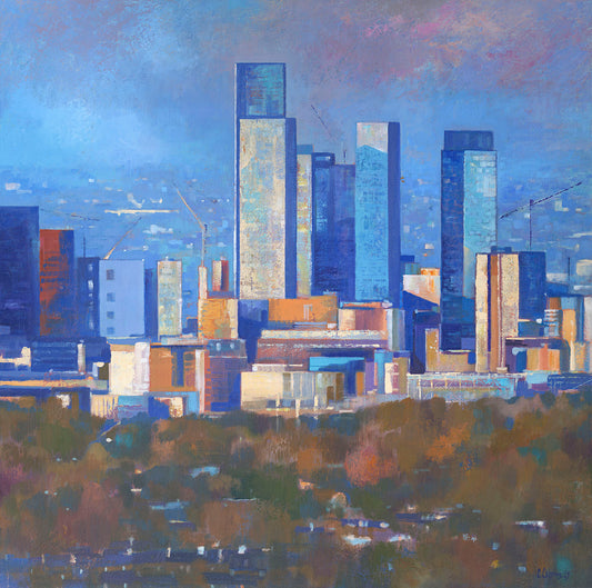 Sundrenched ~ Gicleé Print by Artist Chris Cyprus 2025. From the edge of the pennines looking over the horizon of Manchester. Blocky highrise buildings loom in the distance, above the trees with cranes in the background 