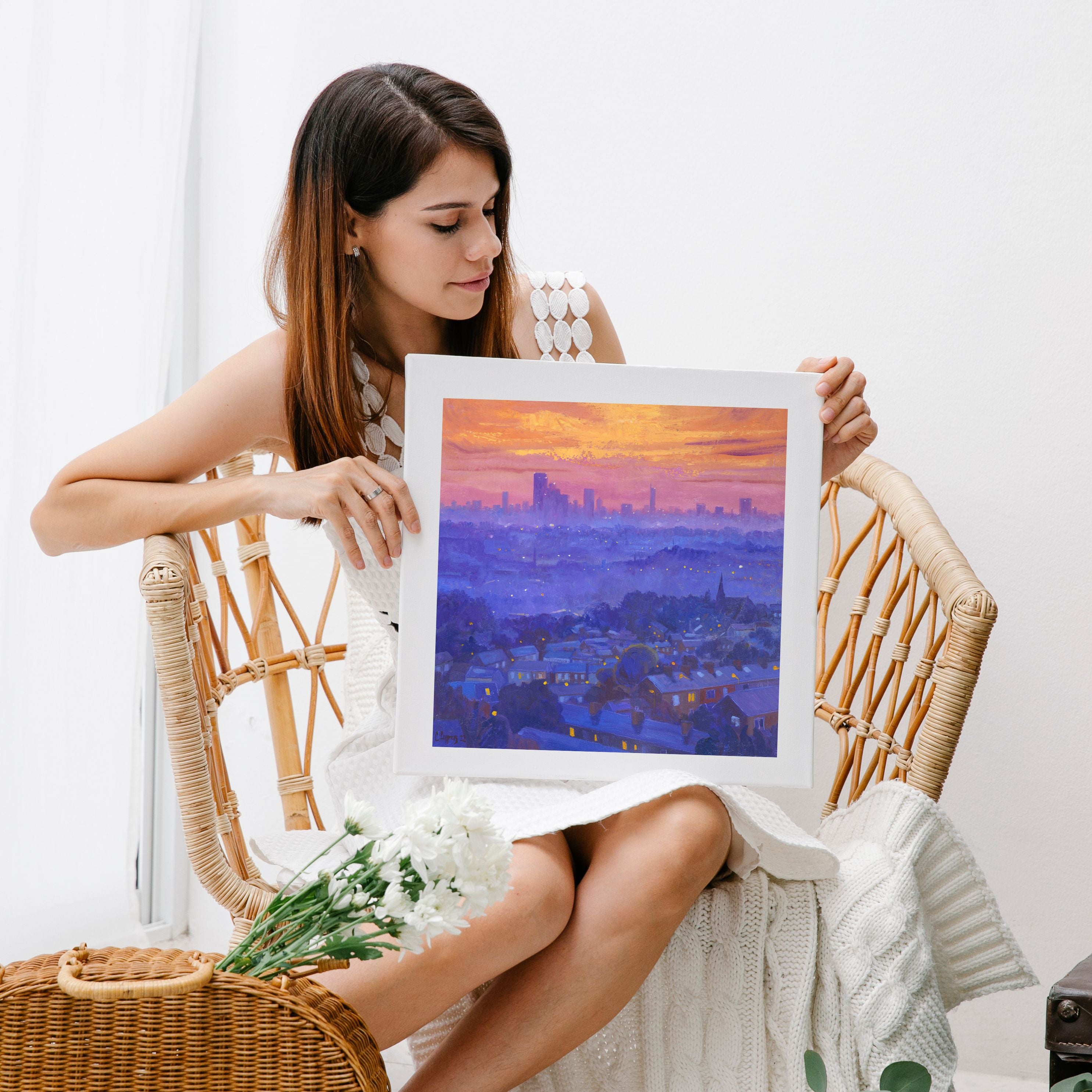 Skyline Sunset giclee print. The print is shown being held by a woman as the actual size