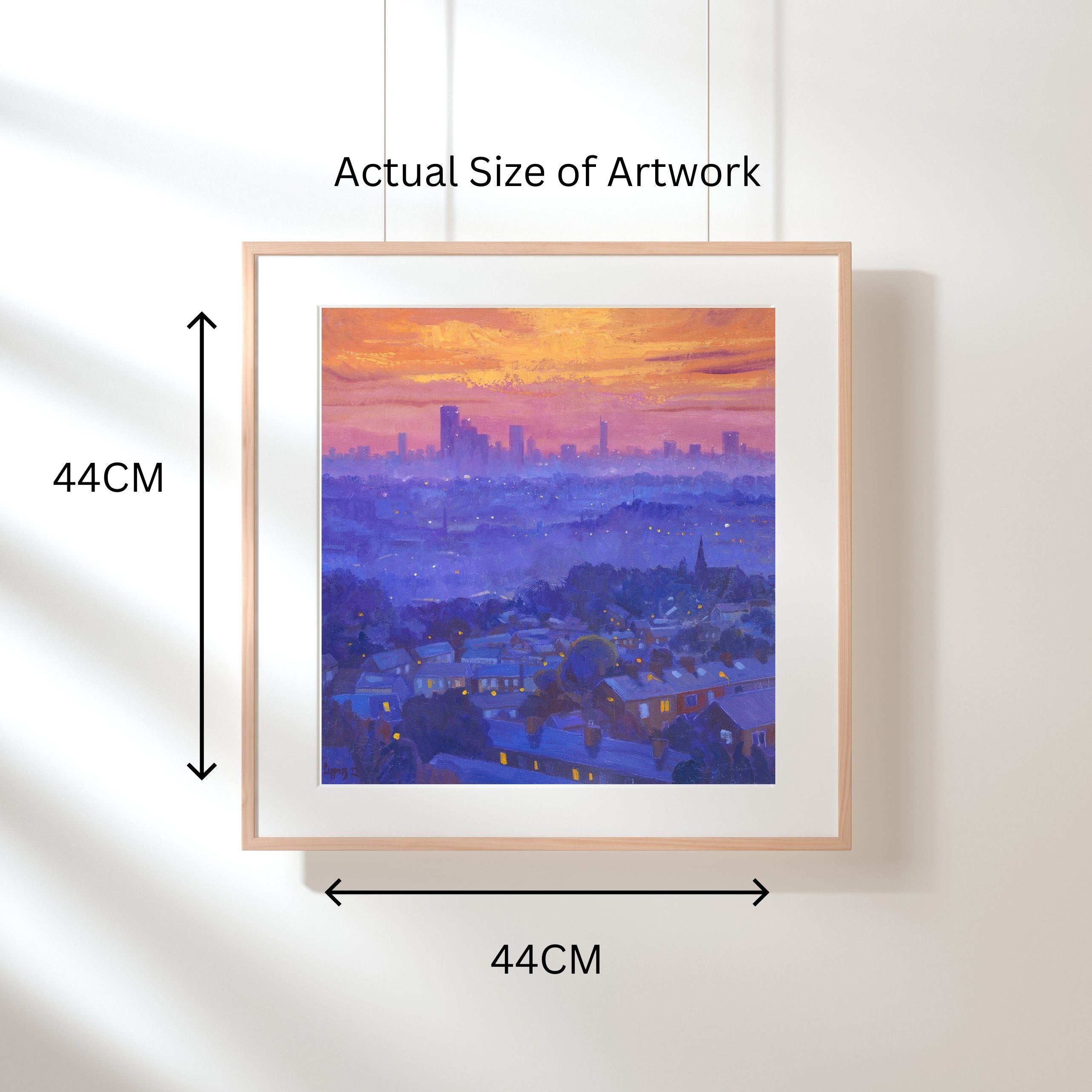 Skyline Sunset ~ Gicleé Print of Manchester skyline by Artist Chris Cyprus . 44cm x 44cm. Shown displayed in a frame 