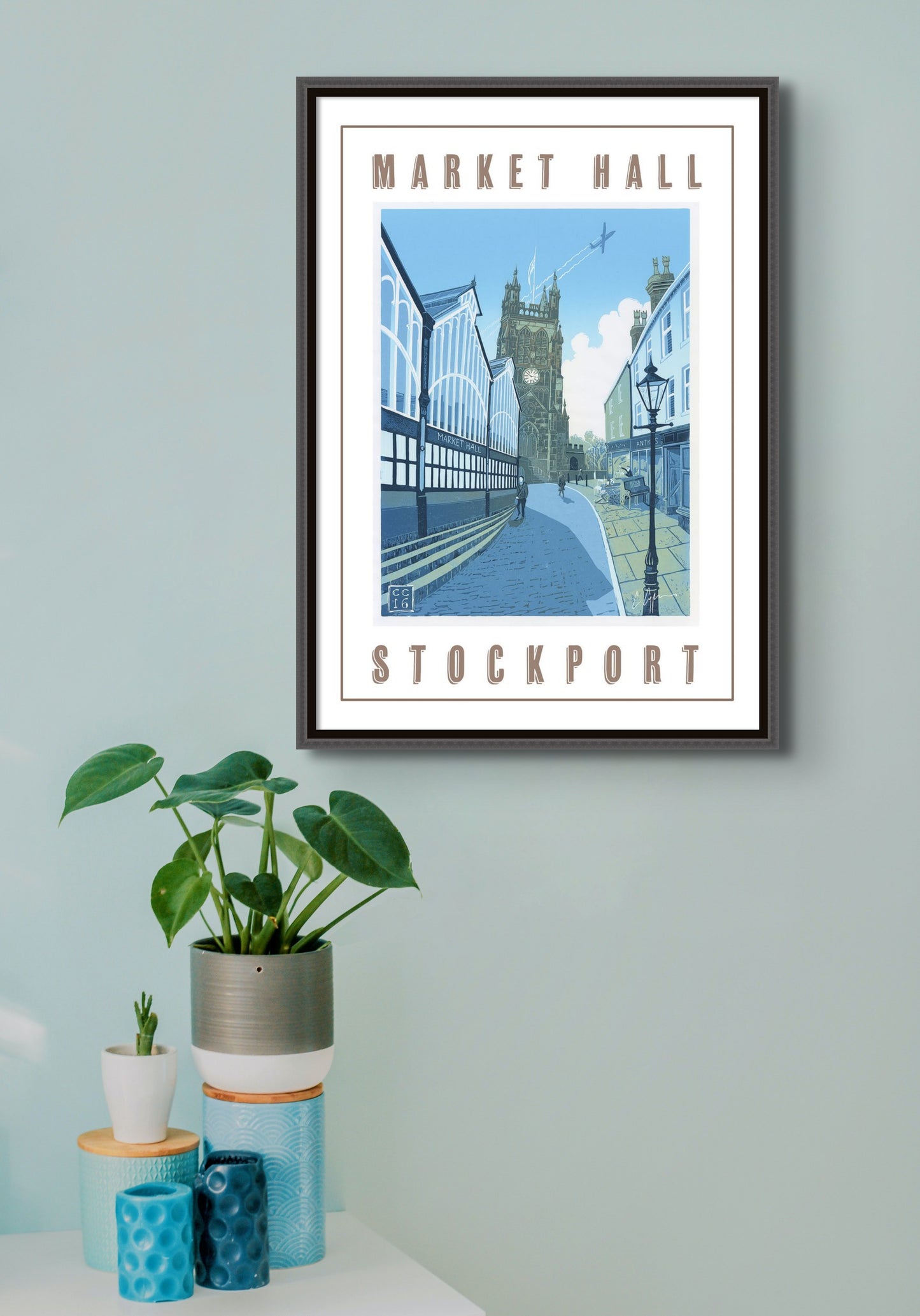 A beautiful reproduction poster of my 2016 linocut of Stockport Old Town, featuring the Market Hall and St. Mary's Parish Church          A2 size         Printed on 250gsm silk board paper - sustainably sourced         Tube rolled ideal for worldwide shipping. The image shows the poster framed and displayed 